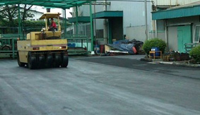 Country road leading towards a mountain in the distance
